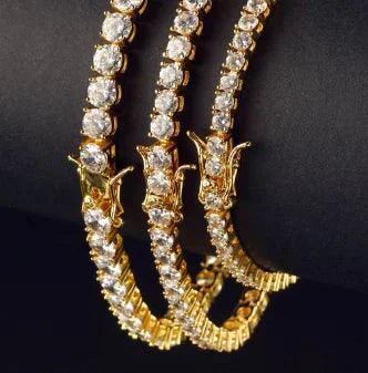 18K gold plated zircon tennis bracelet by MANDOTOS featuring sparkling cubic zirconia stones and a sleek, elegant design.