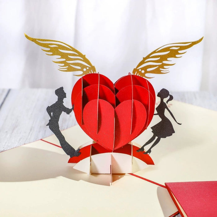 Mandotos 3D laser-cut engagement card featuring a red heart and romantic silhouette design.