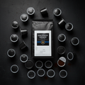 Gun Powder Grinds bag with scattered K-cups overhead