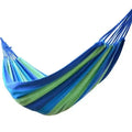 Mandotos Adventure Ready Hammock shown hanging between trees, durable fabric and compact design for outdoor camping and relaxation.