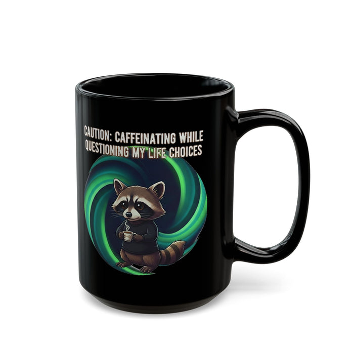 Black mug with a raccoon graphic and humorous text on a white background