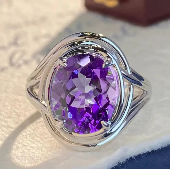 Close-up of MANDOTOS Chic Amethyst Copper Ring showcasing a polished amethyst gemstone set in a sleek copper band.