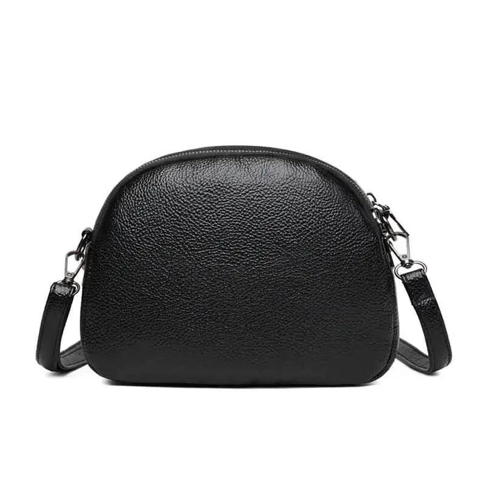 Mandotos chic leather circle purse with a sleek design and zipper closure, perfect for stylish everyday use.