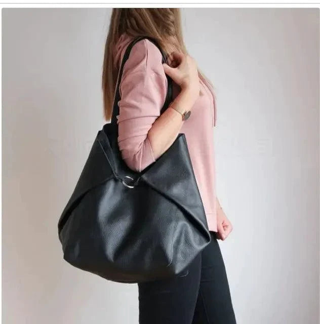 Mandotos chic leather tote handbag with sturdy handles and sleek design, perfect for everyday use.