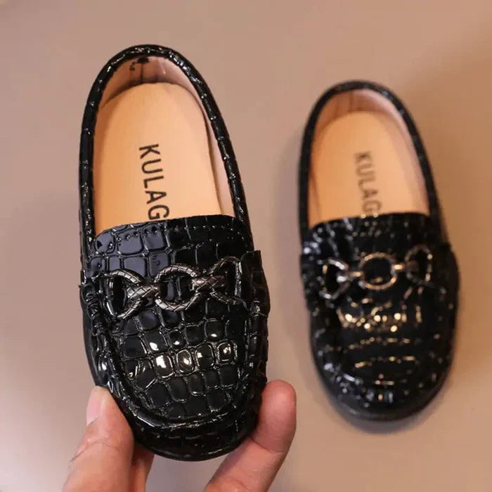 Chic toddler leather kicks by MANDOTOS, featuring stylish design and soft leather material for young children's comfort.