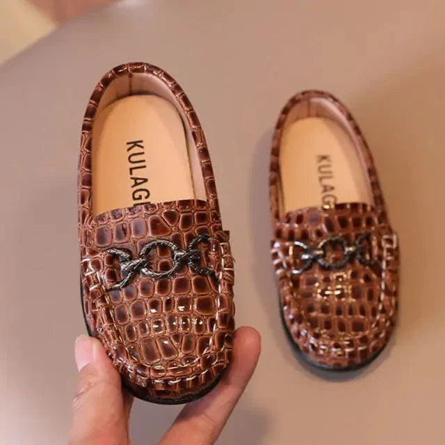 Close-up of stylish toddler leather shoes by MANDOTOS, featuring soft leather and durable soles for comfortable kids' footwear.