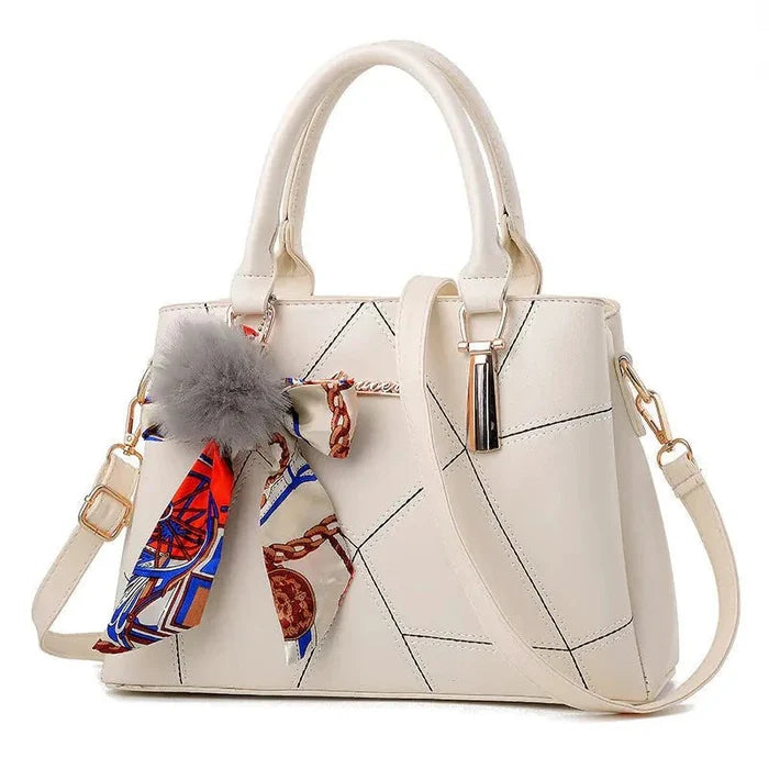 Chic women's crossbody tote bag by MANDOTOS with sleek design, sturdy strap, and spacious interior for everyday use.