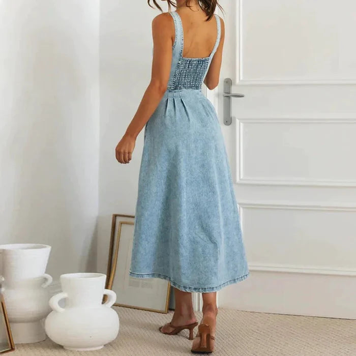 Mandotos CitySleek denim midi dress featuring a fitted silhouette and classic denim fabric, displayed on a hanger.