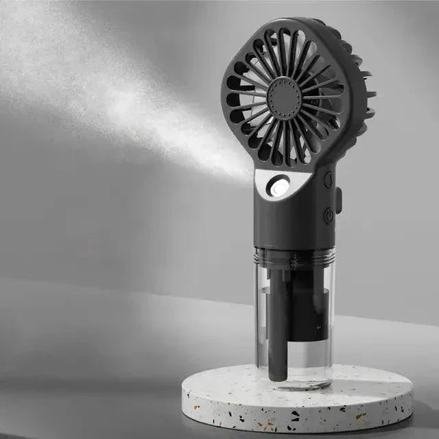 Mandotos Compact Hydrating Mist Fan showing the portable fan with mist spray feature and ergonomic handle for refreshing comfort.