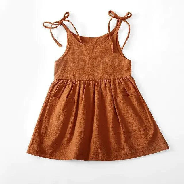 Toddler girl wearing a cotton chic sundress by MANDOTOS, featuring a stylish, lightweight design perfect for warm weather.