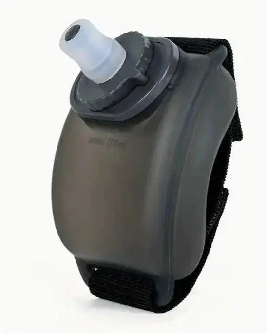 Mandotos cycling wrist water bottle secured around wrist, easy to access hydration for outdoor cycling activities.