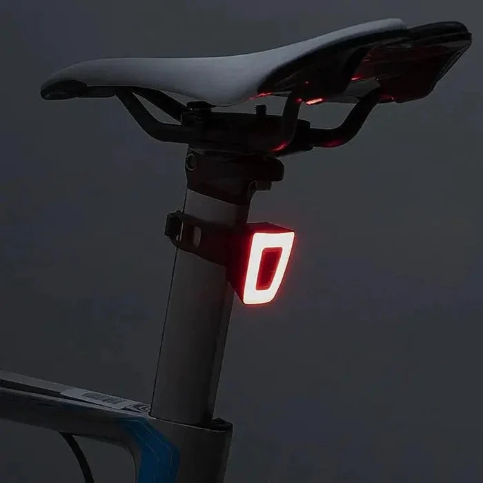 MANDOTOS Cyclist's Beacon USB rechargeable waterproof bike light attached to a bicycle for visibility and safety during night rides.