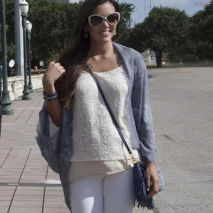 Mandotos denim blossom poncho with floral design, lightweight and stylish for casual wear.