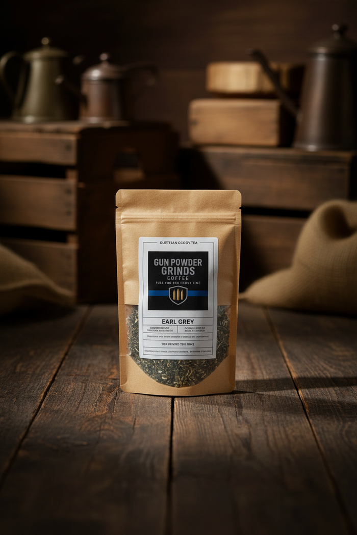 Gun Powder Grinds Earl Grey on wooden surface