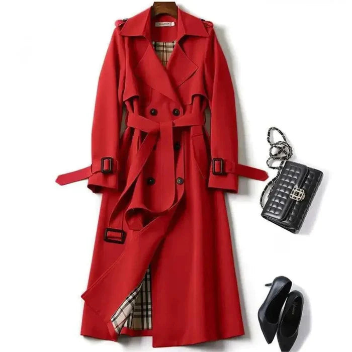 Mandotos elegant classic trench coat displayed on a hanger, showcasing its sleek design and timeless style.