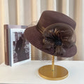 Elegant floral top hat from MANDOTOS INTERNATIONAL, suitable for autumn winter fashion, weddings, and parties, featuring a stylish fedora design.