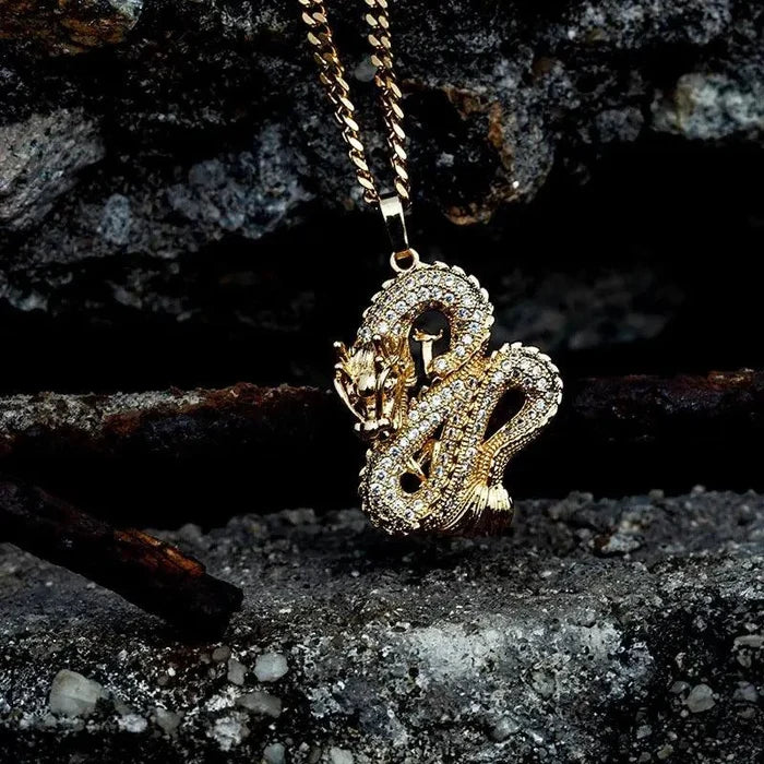 Elegant gold zircon dragon pendant by MANDOTOS featuring detailed dragon design and sparkling zircon accents.