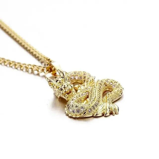 Elegant gold zircon dragon pendant by MANDOTOS, featuring intricate design and sparkling stones on a chain.