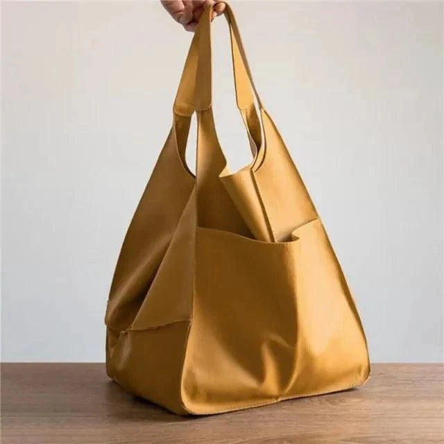 Elegant women's tote bag by MANDOTOS, showcasing a stylish leather design with sturdy handles and spacious interior.