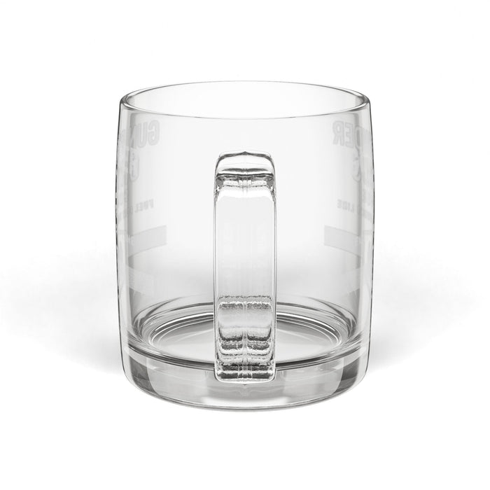 Clear glass tumbler with a unique base design on a white background