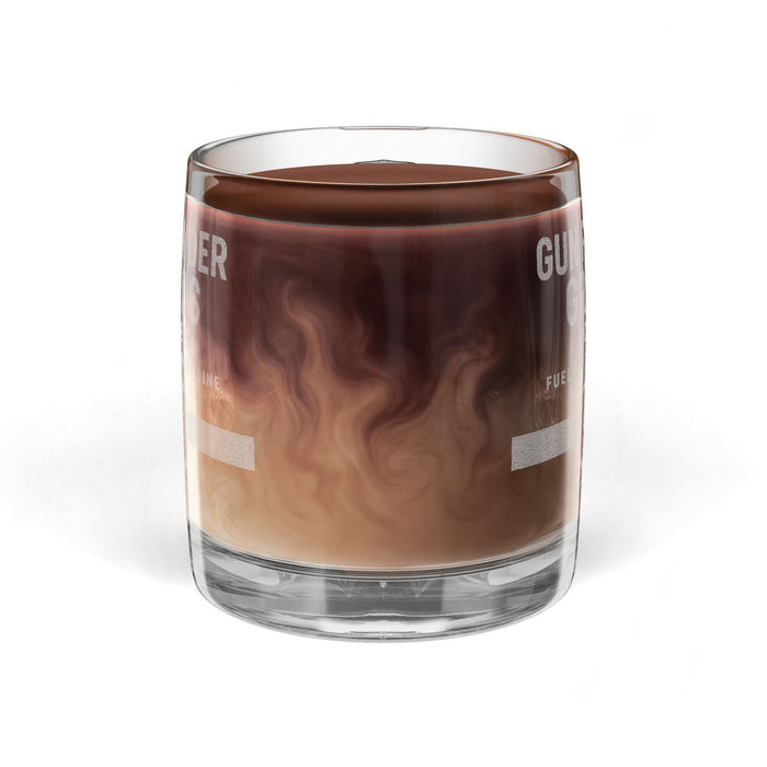 Glass filled with a layered brown and beige liquid on a white background