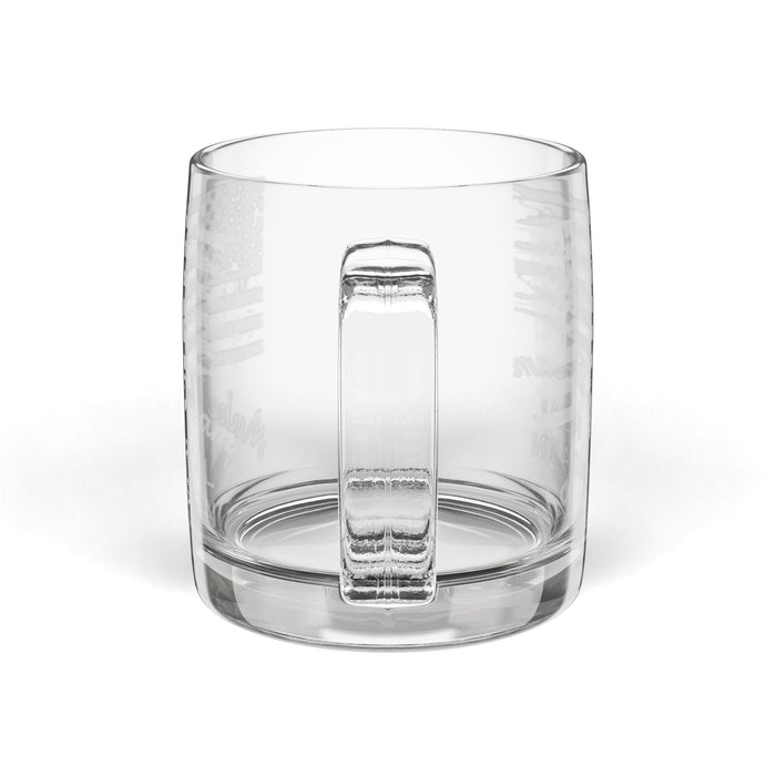 Clear glass tumbler with a handle on a white background