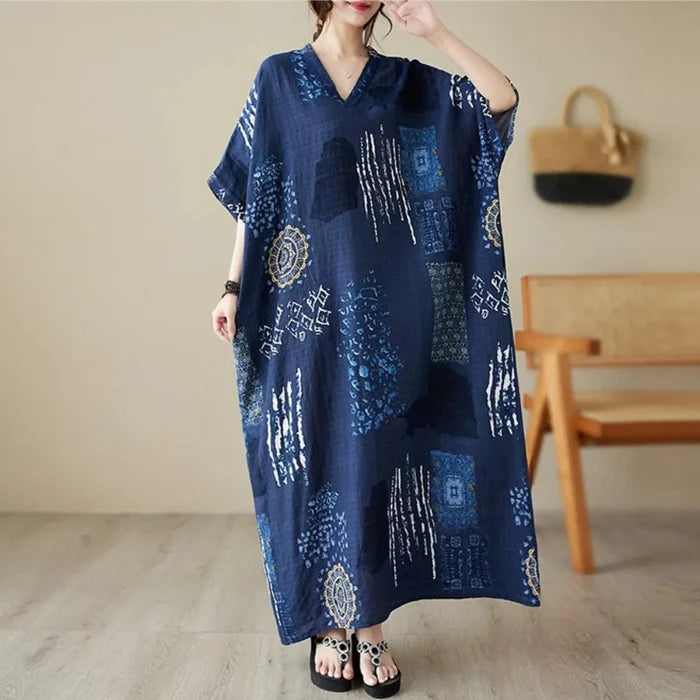 Ethnic Bohemian beach dress for women by MANDOTOS INTERNATIONAL, featuring casual, flowy fabric with vibrant patterns and a relaxed fit.