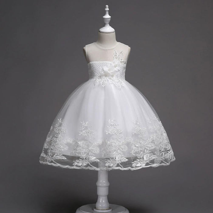 First Communion flower girl dress by Mandotos with lace trim, tulle fabric, and intricate bead embroidery.