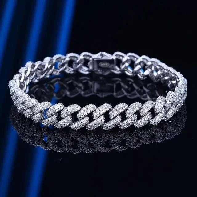 18k gold Cuban link bracelet by MANDOTOS, showcasing a shiny, interlocking chain design on a sleek jewelry display.