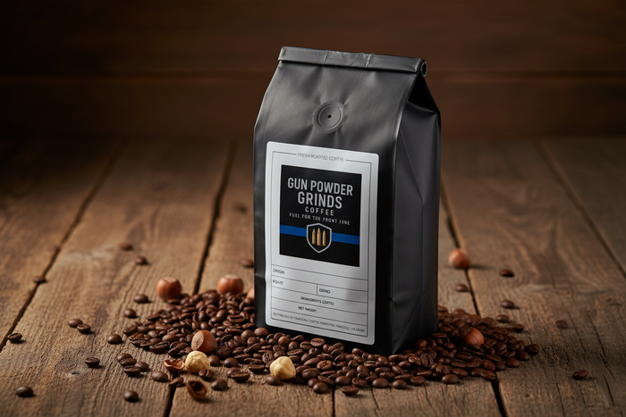 Gun Powder Grinds Hazelnut on rustic surface with hazelnuts
