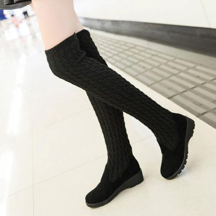 Mandotos high flat over-the-knee stretch Martin boots in black leather, stylish and fitted for a sleek look