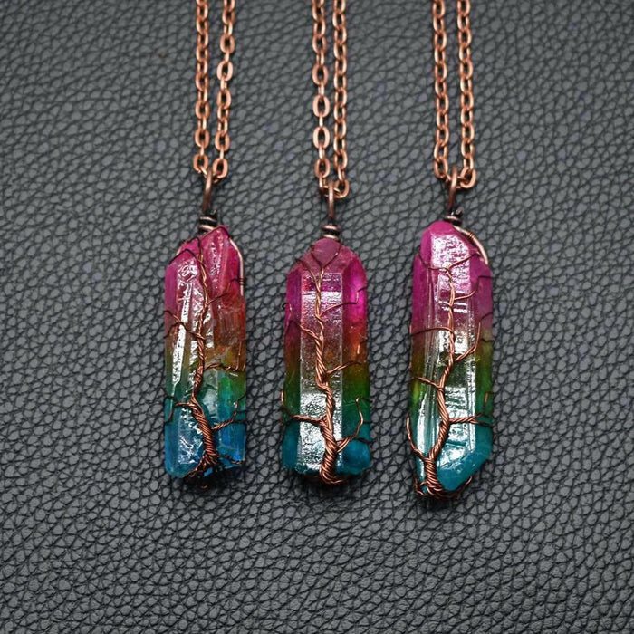 Mandotos crystal stone pillar Tree of Life pendant necklace showcasing a detailed, elegant design on a chain.