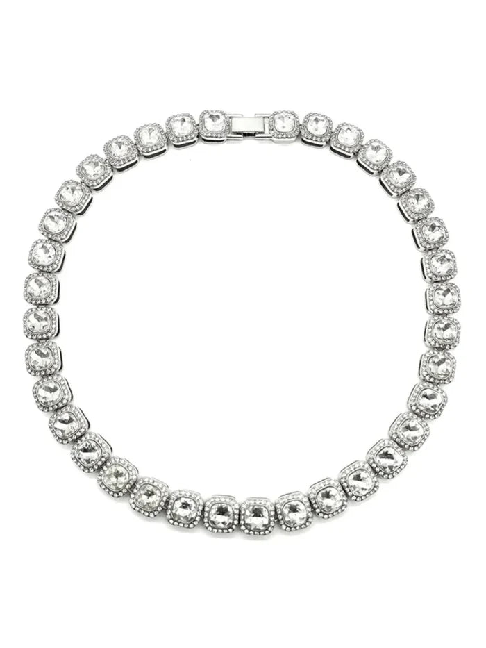 Mandotos Illumina tennis chain with clustered stones and radiant embellishments, showcasing elegant jewelry design and sparkling details.