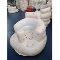 Inflatable baby chair by MANDOTOS designed for dining and bath, with soft, colorful inflatable cushions for comfortable seating.