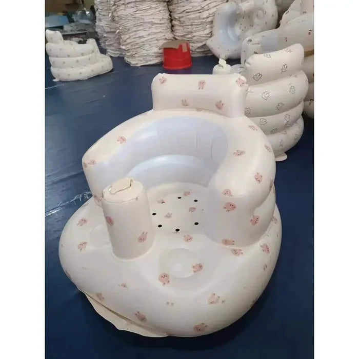 Inflatable baby chair by MANDOTOS designed for dining and bath, with soft, colorful inflatable cushions for comfortable seating.