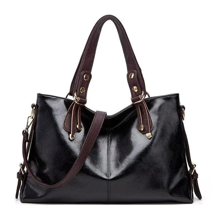 Mandotos Kathie leather tote purse with sturdy handles and spacious interior, showcasing a stylish, high-quality leather design.
