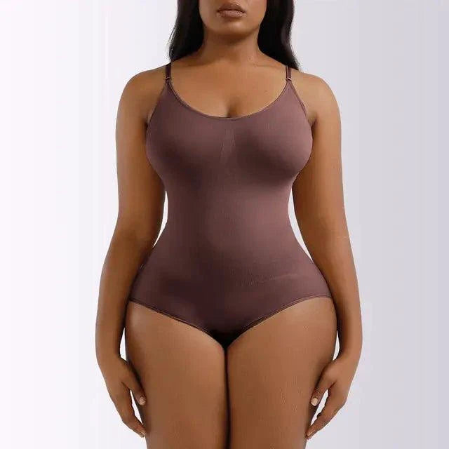 Mandotos Ladies' curve-enhancing shaper bodysuit, seamless design, black color, close-up of the fitted, shaping garment on a model.