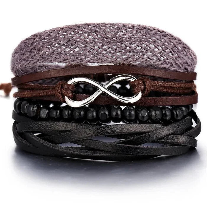 Layered leather charm bracelet by MANDOTOS featuring multiple leather strands and metal charm accents.