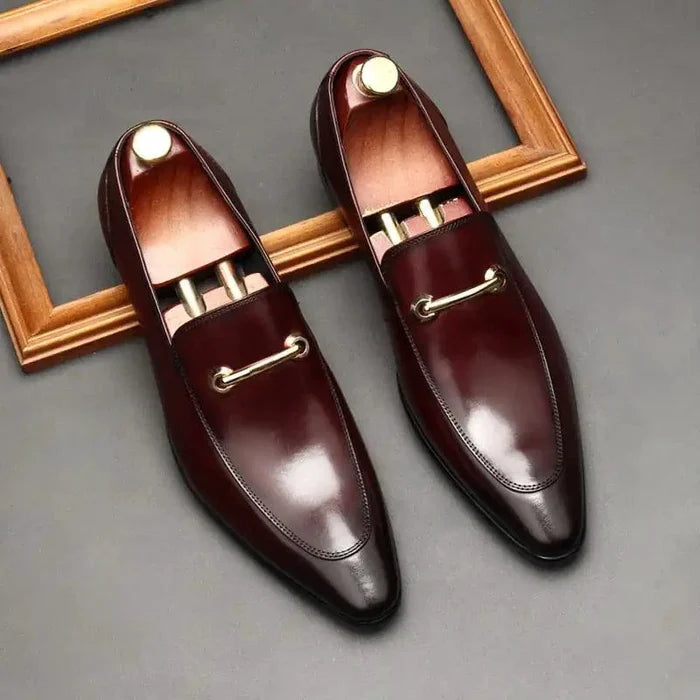 Mandotos men's leather loafers featuring classic slip-on design and sleek brown finish, perfect for casual or formal wear.