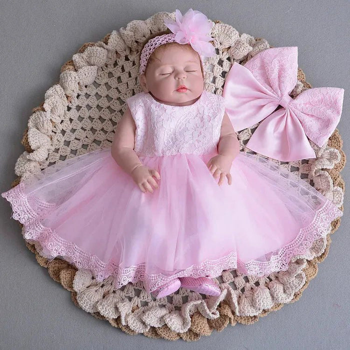 Little Princess gown by MANDOTOS INTERNATIONAL featuring a pink ruffled dress with satin bow, perfect for young princesses.