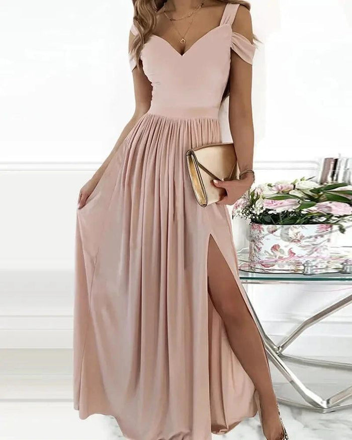 Elegant MANDOTOS Greek style long floor-length pleated dress displayed, showcasing flowing fabric and intricate pleats.