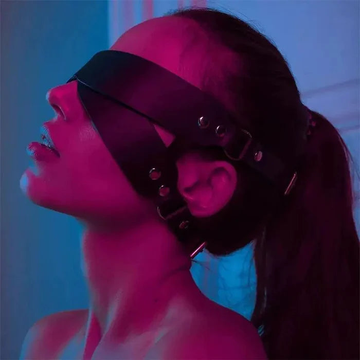 Luxury leather sleep mask by MANDOTOS featuring soft, dark brown leather and an adjustable strap for comfortable nighttime wear.