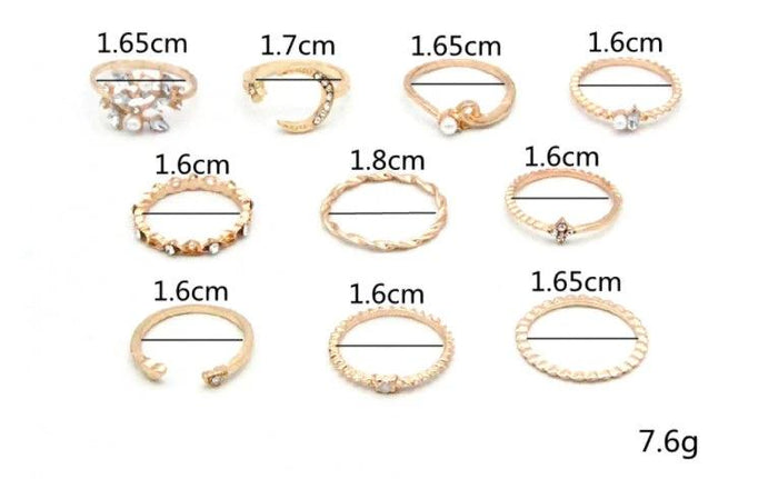 Mandotos Bohemian star, moon, pearl, and leaf ring set with gold finish, featuring 10 stackable rings on a white background.