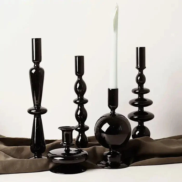 Mandotos Elegant Rue black glass candlestick holder on a table, stylish centerpiece and gift idea for home decor.