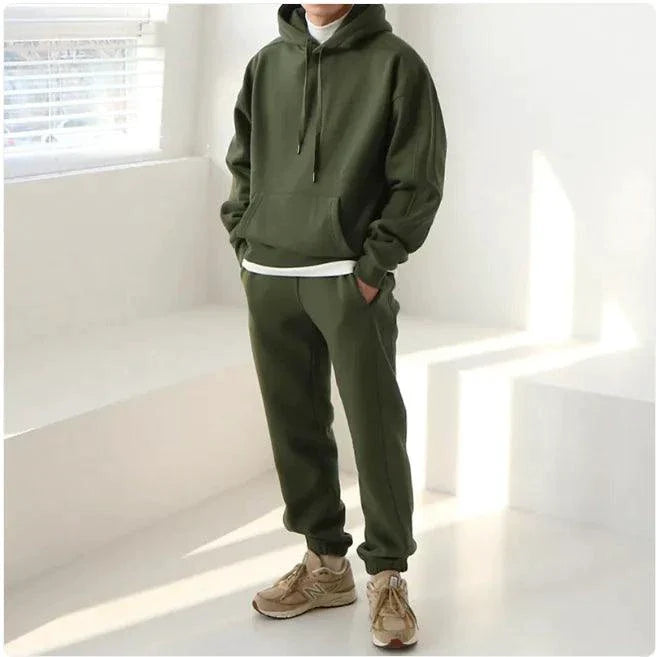 Men's hooded sports sweatshirt by MANDOTOS, shown in casual fit with front pocket and drawstring hood, made for active wear.