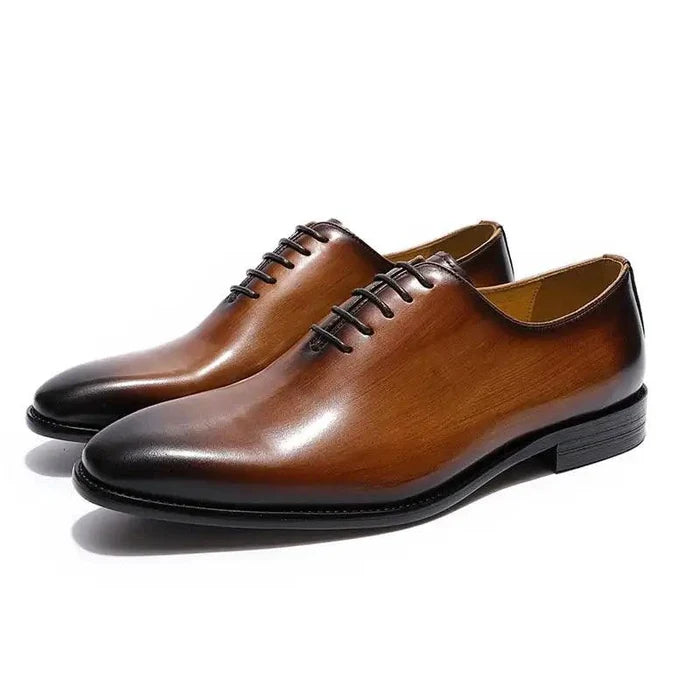 Men's black leather Oxford shoes by MANDOTOS featuring classic lace-up design and polished finish.