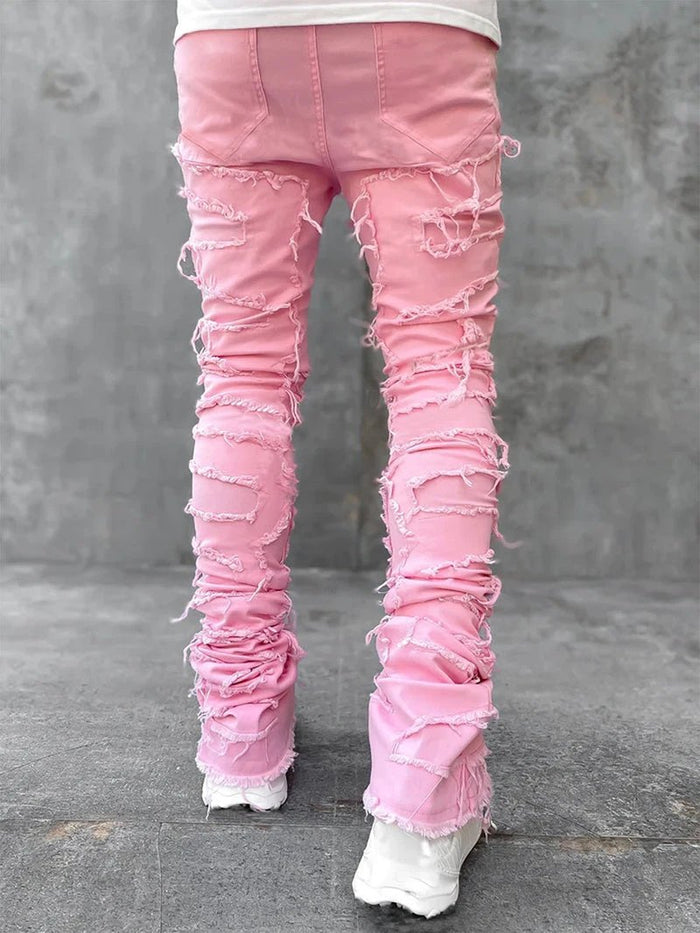 Men's Mandotos stacked jeans with patched design, long tight fit trousers showcasing bold style and detailed denim features.