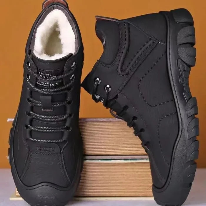 Men's winter ankle boots by MANDOTOS INTERNATIONAL, waterproof and non-slip work shoes with sturdy soles and stylish design.