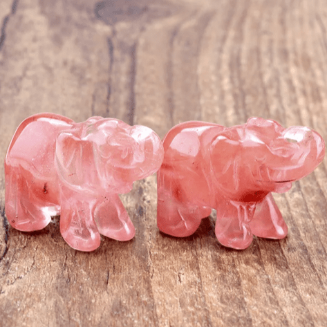 Mini elephant crystal sculpture by MANDOTOS INTERNATIONAL, detailed clear crystal figurine of an elephant on a smooth base.