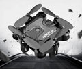 Mini folding drone by MANDOTOS, compact quadcopter with foldable arms, lightweight design, and remote control for aerial photography.
